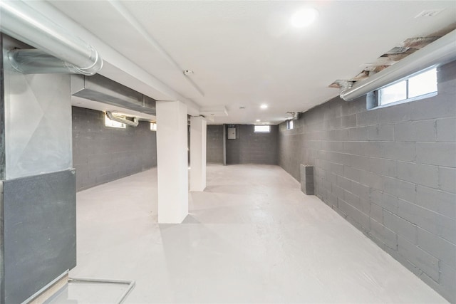 basement featuring recessed lighting