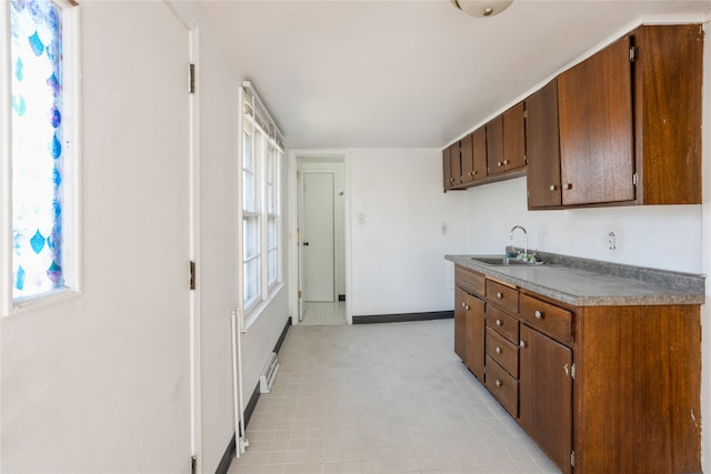 kitchen with a baseboard radiator and sink