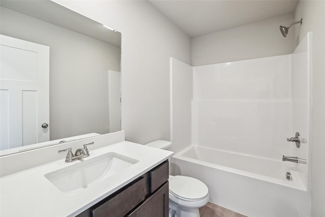 full bathroom featuring toilet, shower / bath combination, wood-type flooring, and vanity