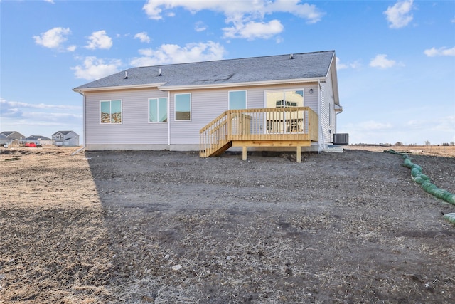 back of property with a deck and central air condition unit