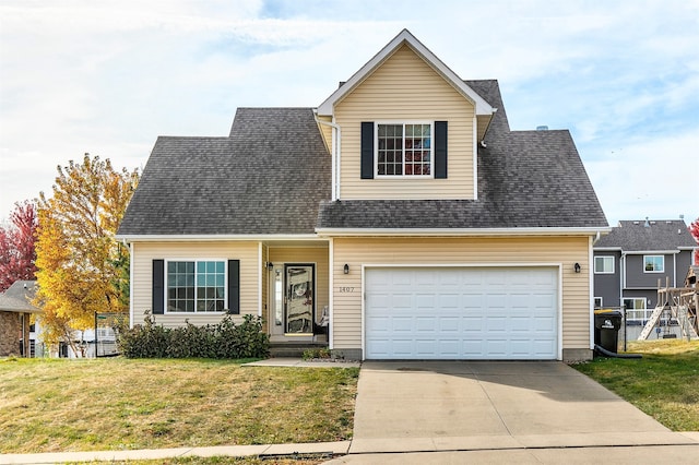 view of front of home featuring a front yard and a garage