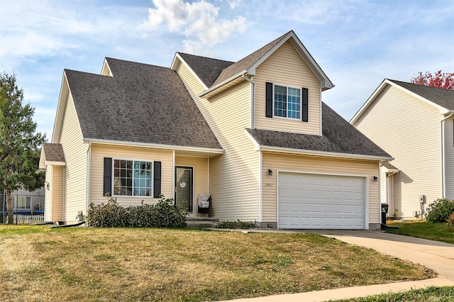 view of front of property with a front lawn and a garage