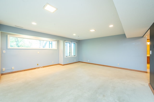 unfurnished room featuring recessed lighting, baseboards, and light colored carpet