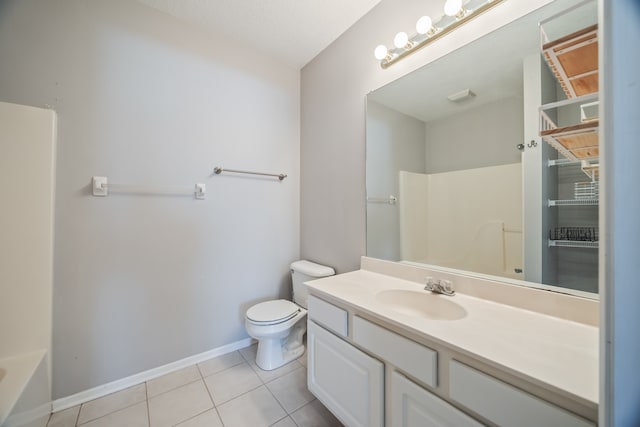 full bathroom featuring tile patterned flooring, vanity, toilet, and washtub / shower combination