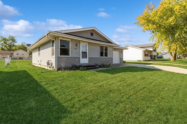 view of front of property with a front lawn and a garage