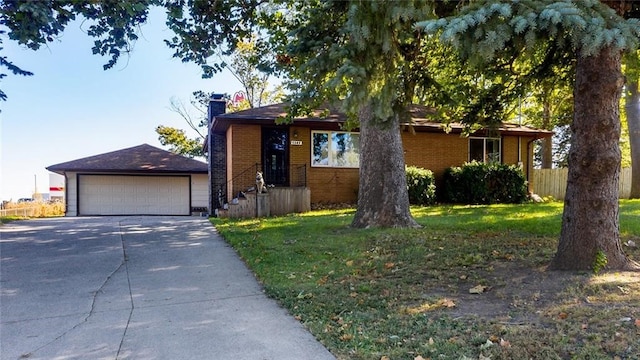 view of front of house featuring a front yard and a garage