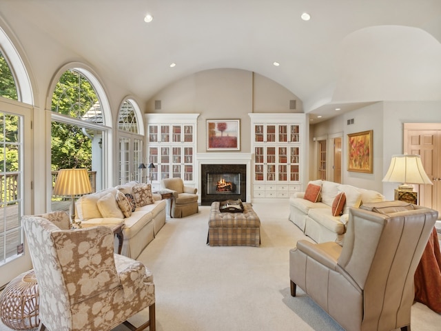 living room featuring vaulted ceiling and light colored carpet