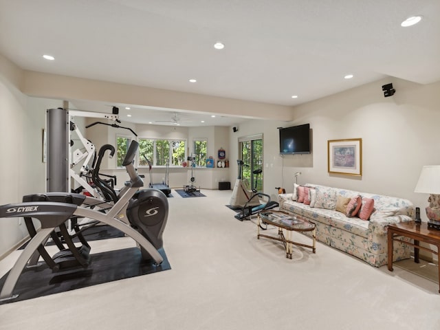 exercise area with carpet flooring and ceiling fan