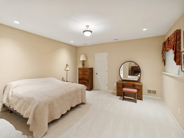 bedroom with light colored carpet