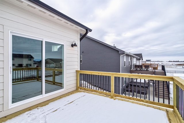 view of snow covered deck