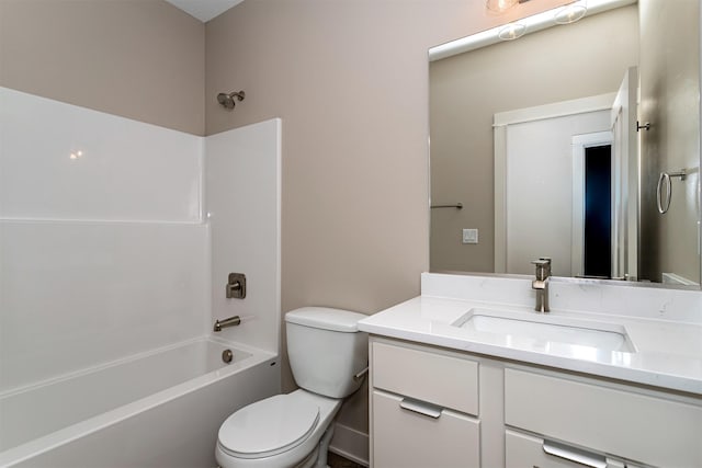 full bathroom featuring toilet, vanity, and  shower combination