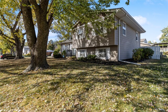 view of home's exterior featuring a yard