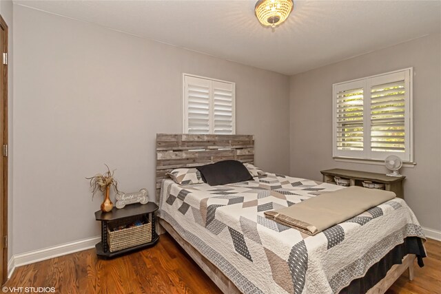 bedroom with hardwood / wood-style floors