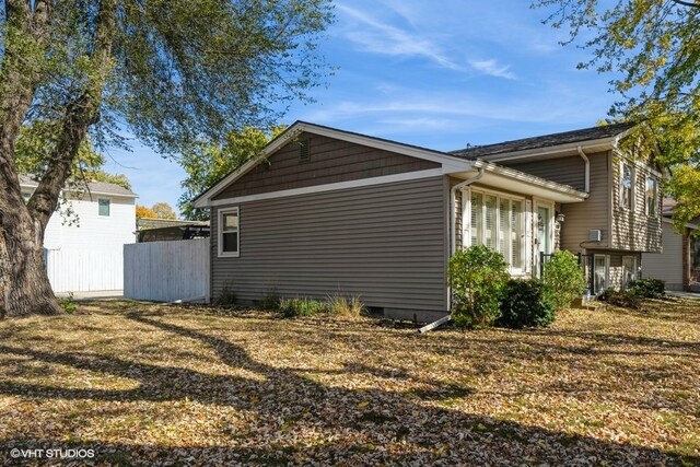 view of home's exterior featuring a lawn