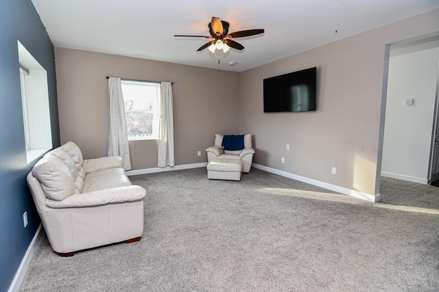 sitting room featuring ceiling fan and carpet floors