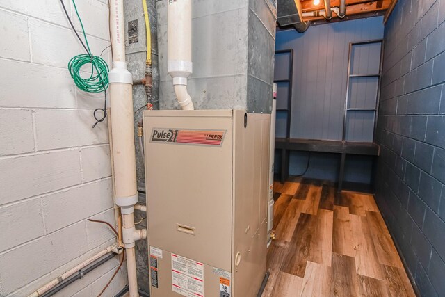 utility room with heating unit