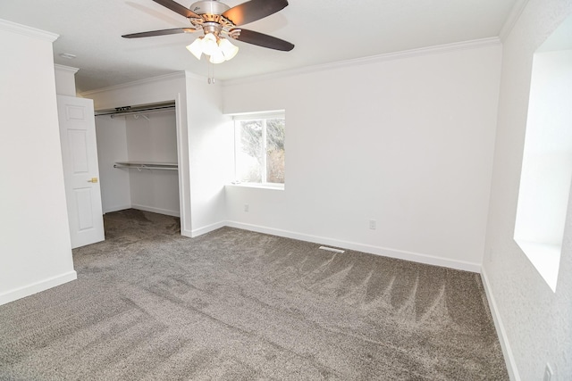 unfurnished bedroom with carpet flooring, ceiling fan, and ornamental molding