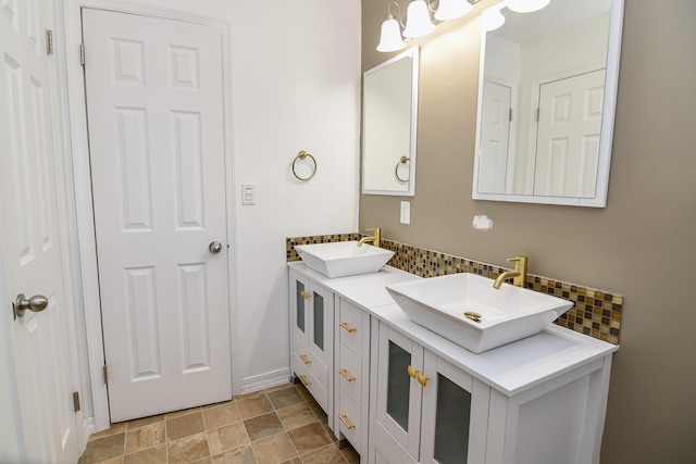 bathroom with vanity and backsplash