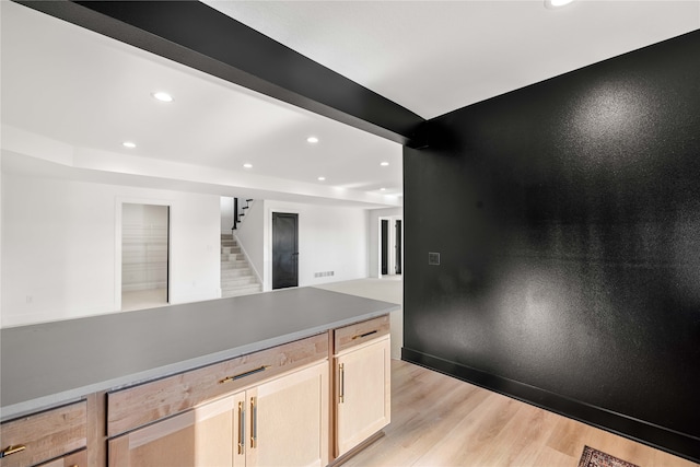 kitchen featuring light hardwood / wood-style flooring and light brown cabinetry