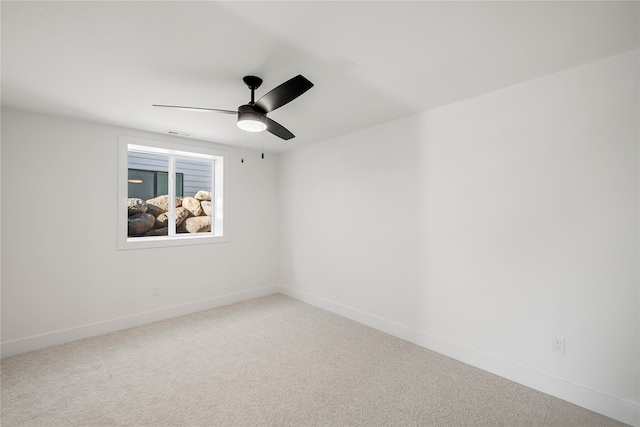 empty room with carpet and ceiling fan