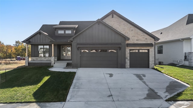 view of front facade featuring a front lawn and a garage