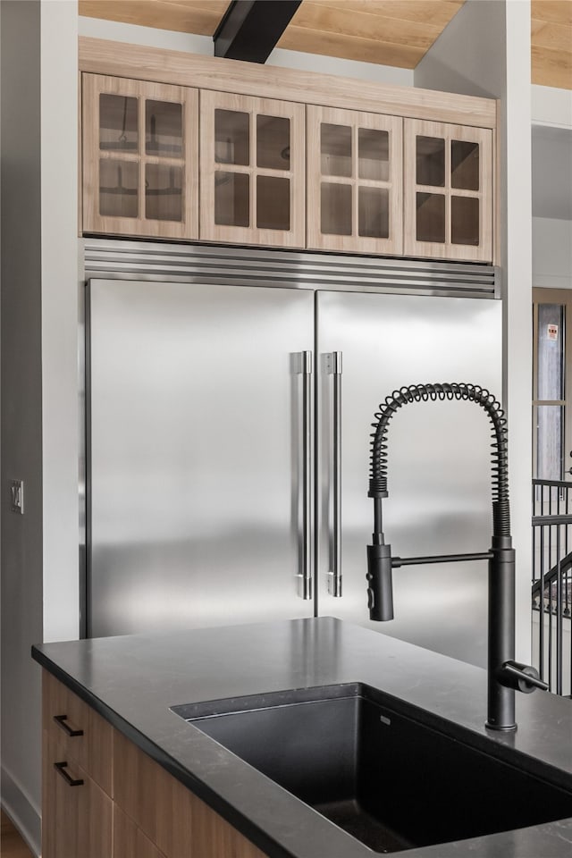 room details featuring sink and wooden ceiling