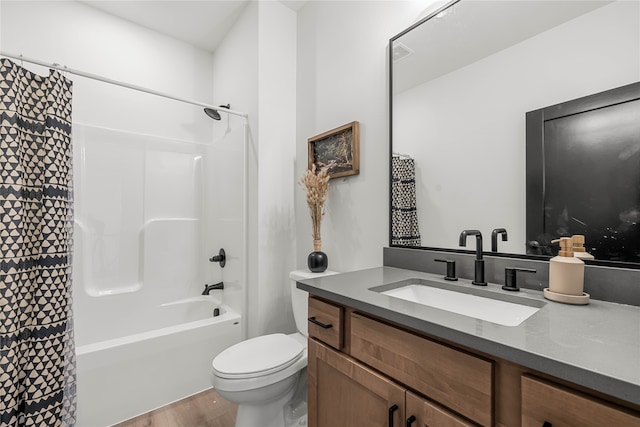 full bathroom featuring vanity, toilet, wood-type flooring, and shower / bathtub combination with curtain