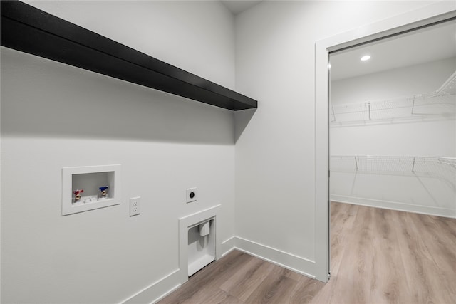 washroom with washer hookup, light wood-type flooring, and electric dryer hookup