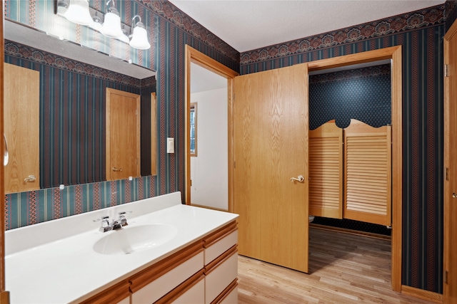 bathroom featuring vanity and hardwood / wood-style flooring