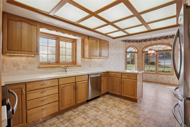 kitchen featuring sink, appliances with stainless steel finishes, and kitchen peninsula