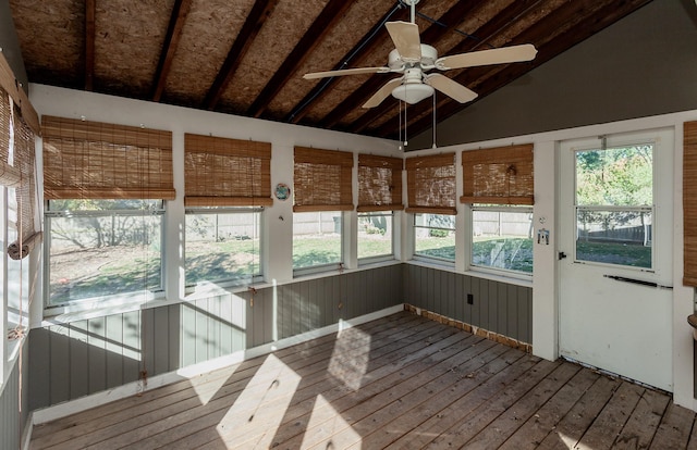 unfurnished sunroom with ceiling fan and lofted ceiling with beams