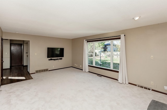 empty room featuring carpet flooring