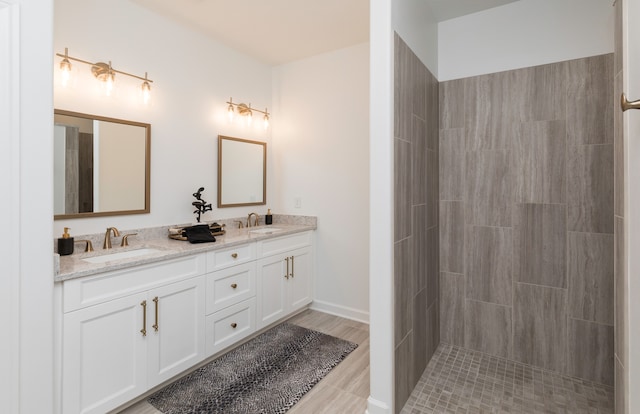 bathroom with vanity and wood-type flooring