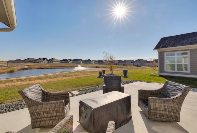 view of patio featuring a water view