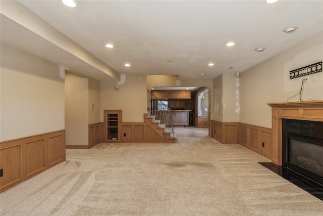 living room with light carpet and a fireplace