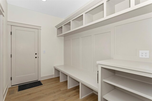 mudroom with light wood-style floors