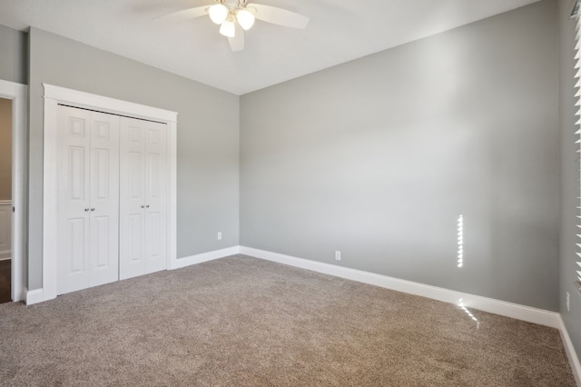 unfurnished bedroom featuring a closet, ceiling fan, and carpet flooring