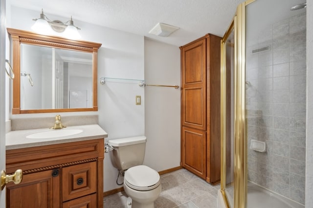 bathroom featuring toilet, an enclosed shower, a textured ceiling, and vanity