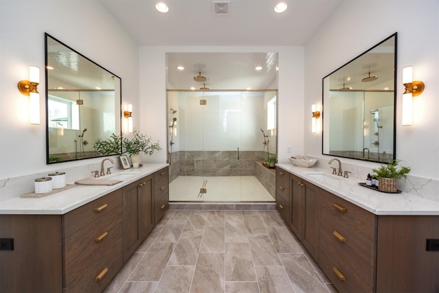 full bath featuring a stall shower, visible vents, a sink, and recessed lighting