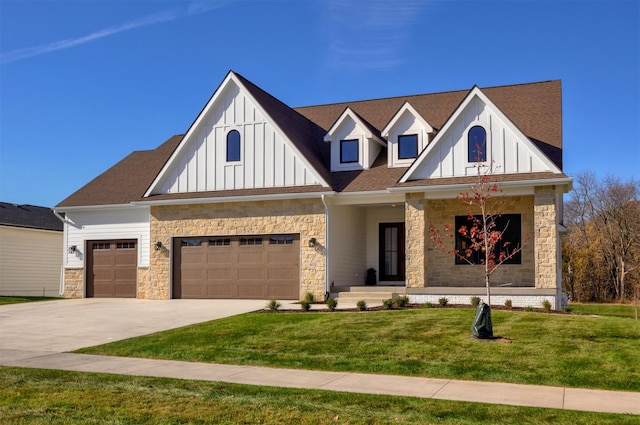 view of front of house featuring a garage and a front lawn