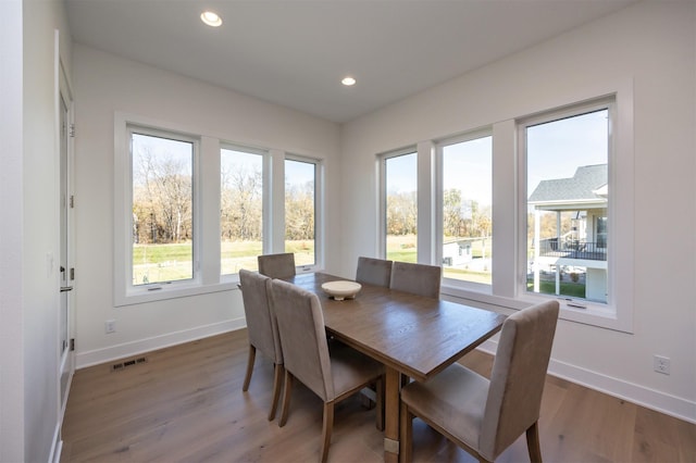 dining area featuring recessed lighting, visible vents, baseboards, and wood finished floors