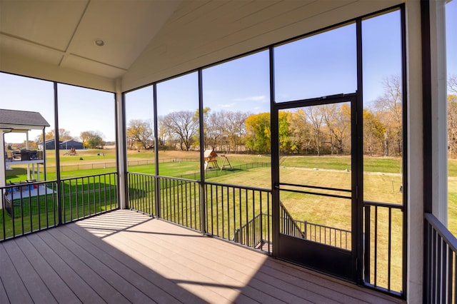 unfurnished sunroom with vaulted ceiling