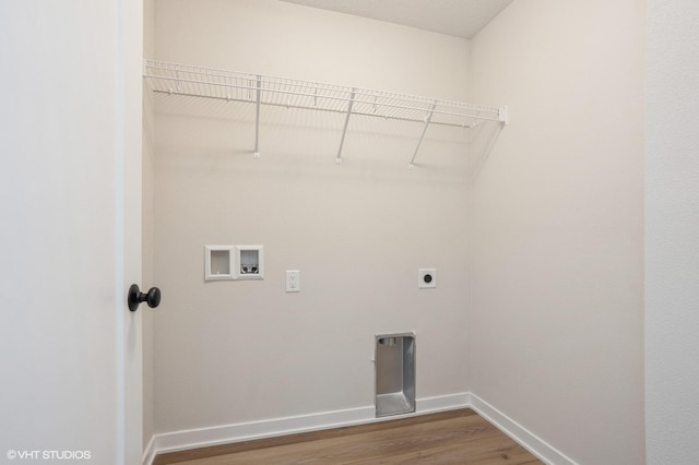 laundry area featuring hookup for a washing machine, hardwood / wood-style floors, and electric dryer hookup