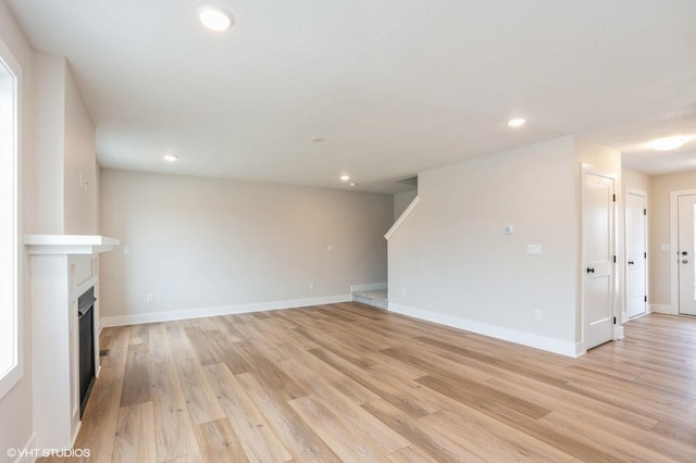 unfurnished living room with light hardwood / wood-style floors