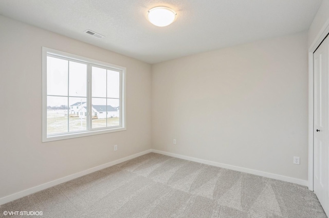 unfurnished room featuring carpet floors