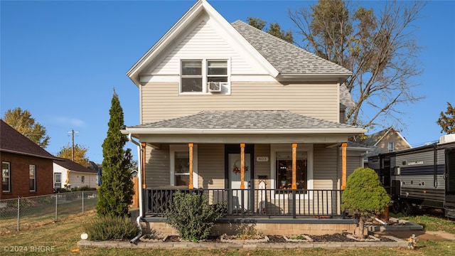 803 W Nevada St, Marshalltown, IA 50158 - view of front of home with a porch, a shingled roof, and fence