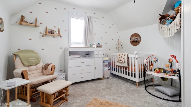 bedroom with light carpet, vaulted ceiling, and a nursery area