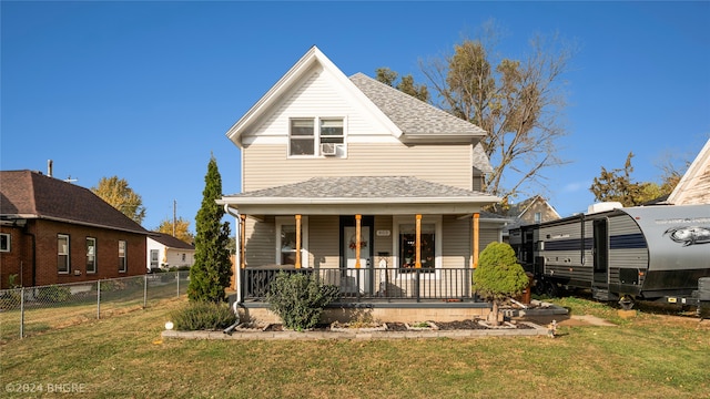 view of front facade featuring a porch and a front lawn