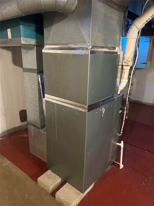 utility room with heating unit