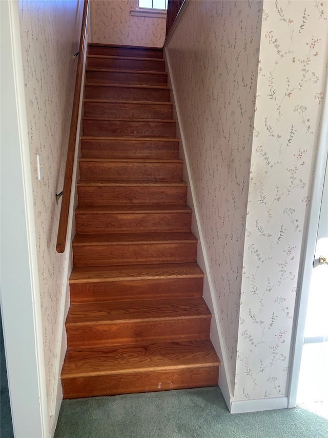stairs featuring carpet flooring and wallpapered walls